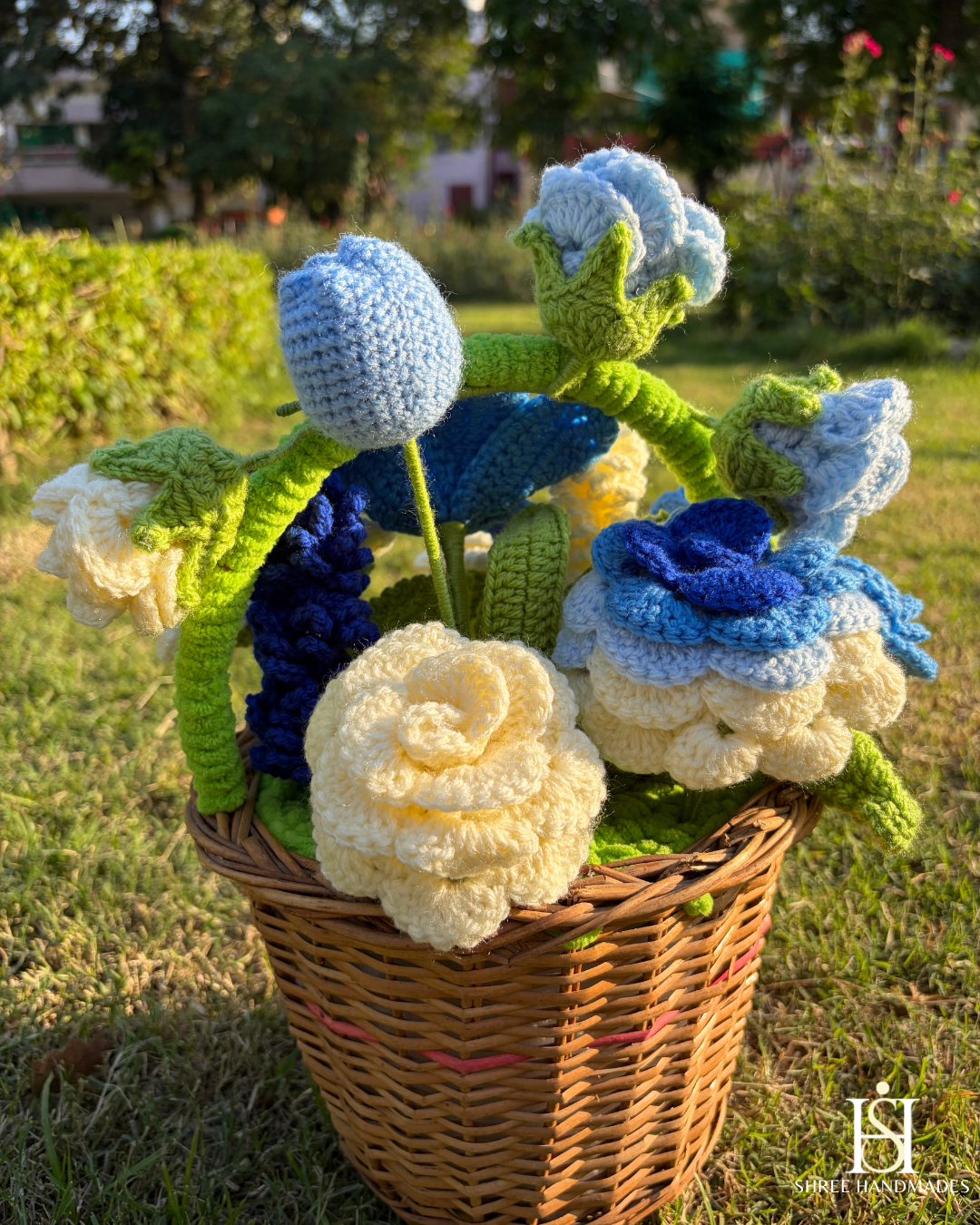 Crocheted blue flowers in a wicker basket.